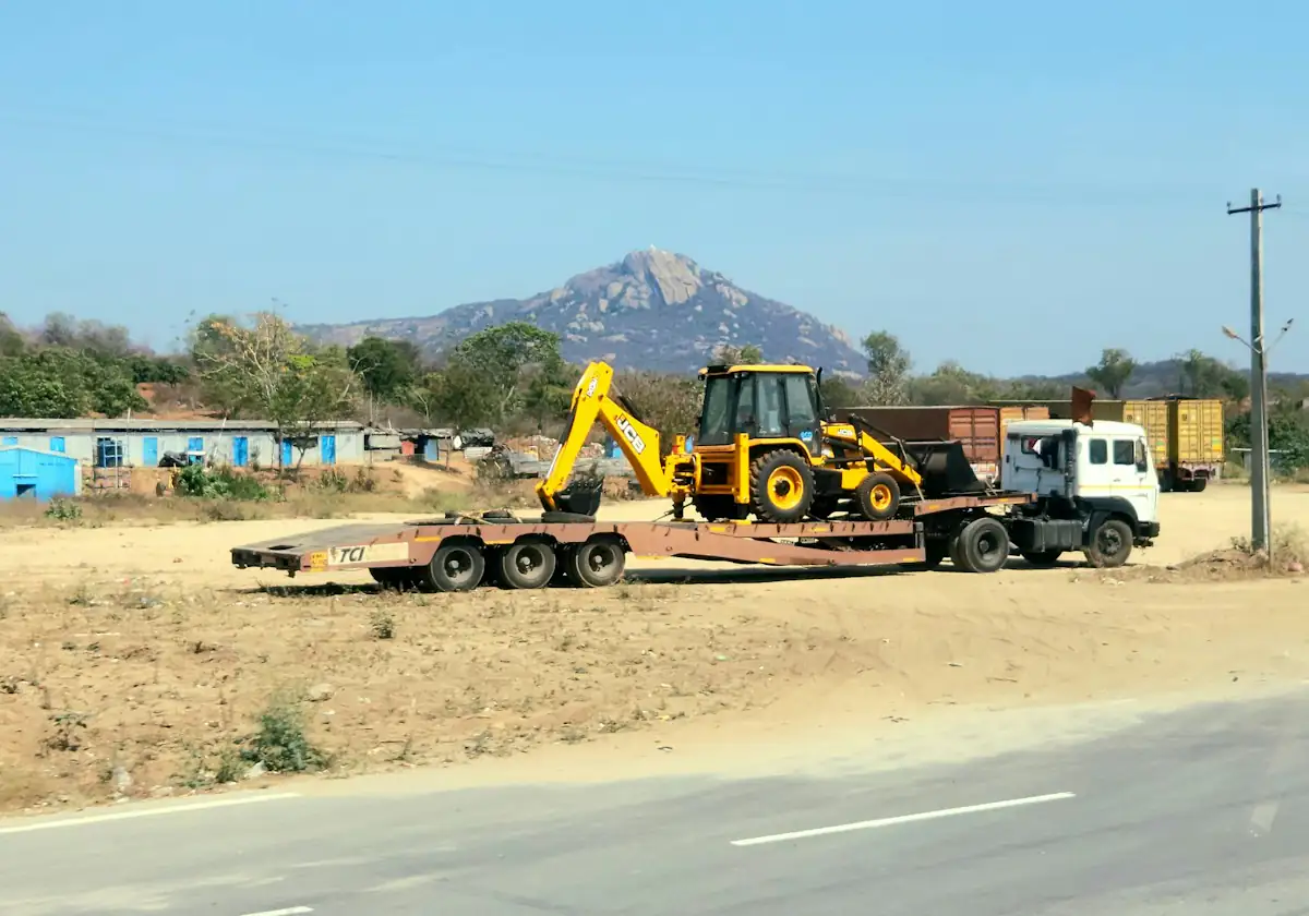 Construction machinery on a low-bed trailer