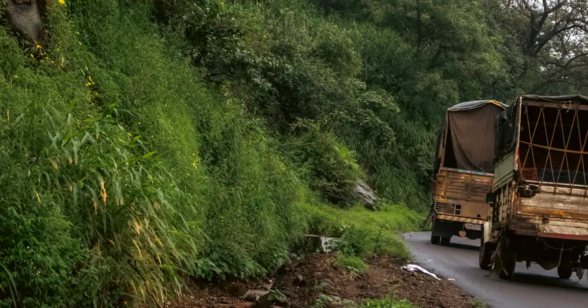 Cargo trucks on a mountain ghat road in India